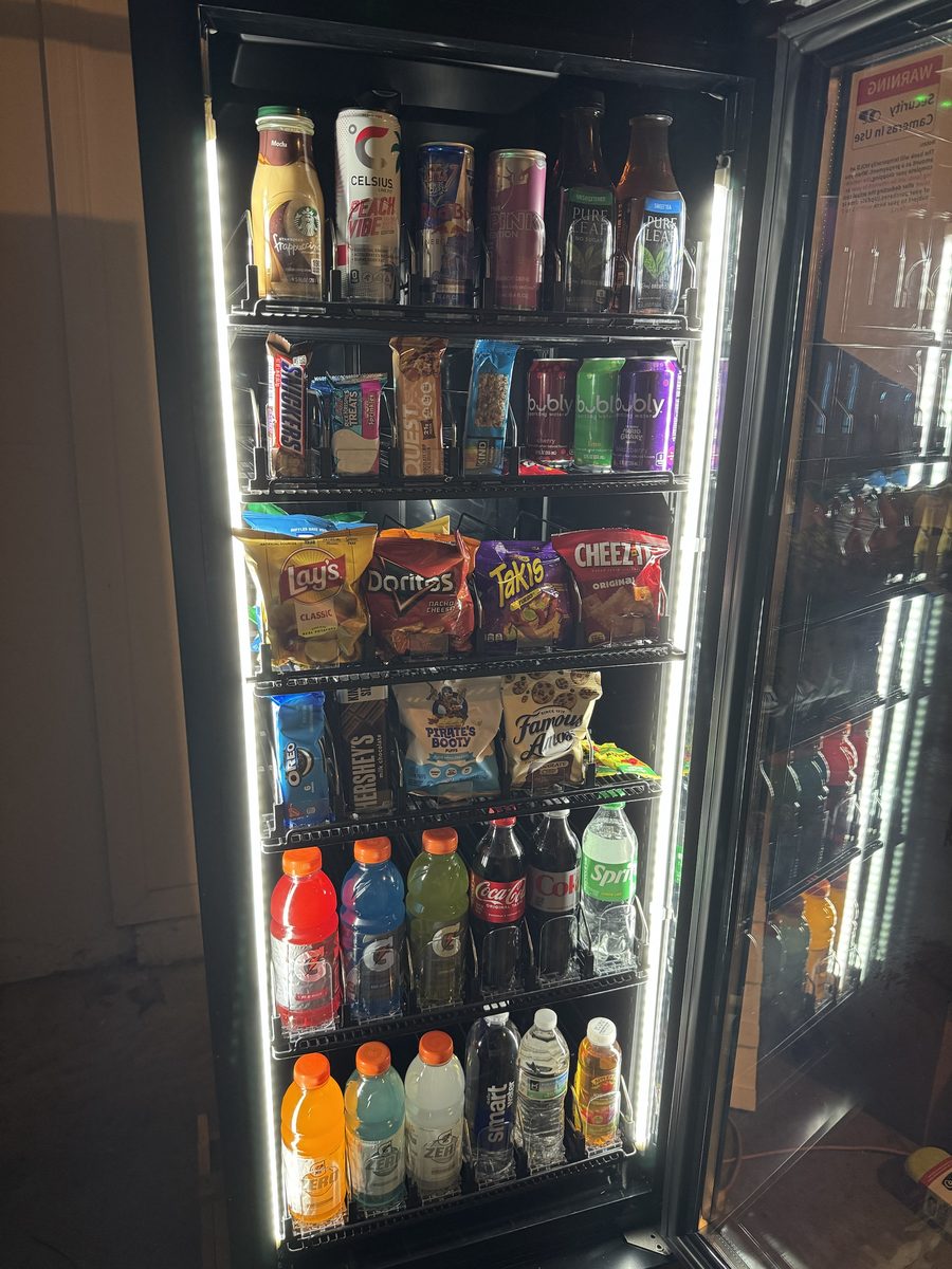 Close-up of the smart market stocked with energy drinks, coffee drinks, snacks, chips, sports drinks, and water